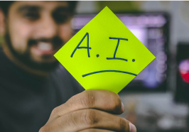 Man holding a sign that says AI