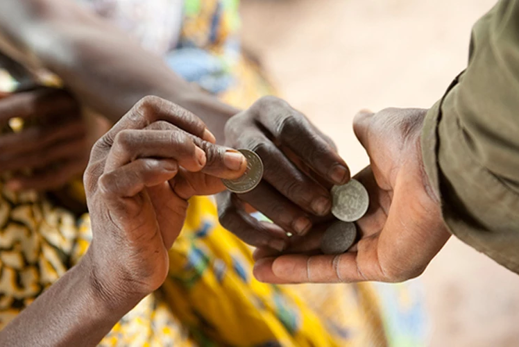 Hands exchanging coins