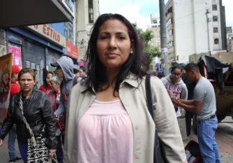 Migrant woman looking at camera
