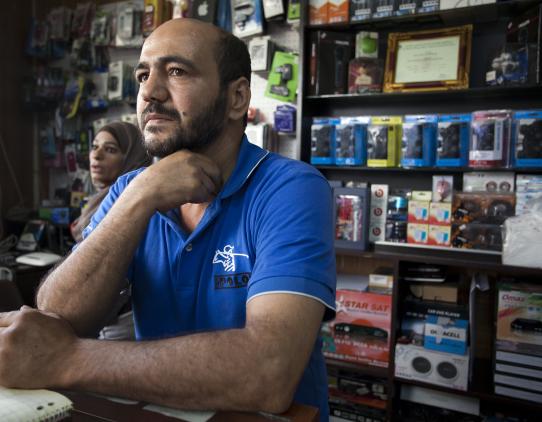 Worker in his store Worker in his store