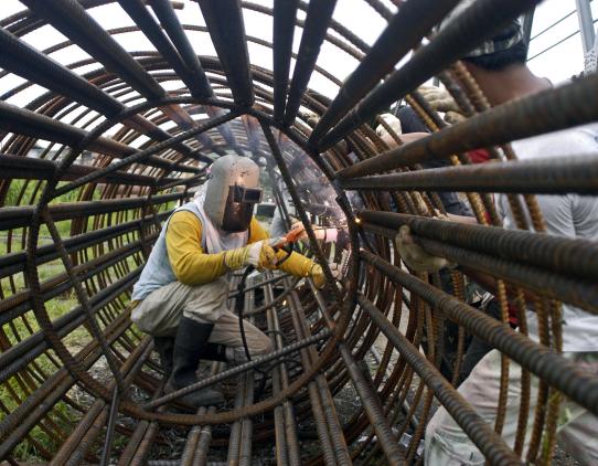 Worker using protective gear Worker using protective gear