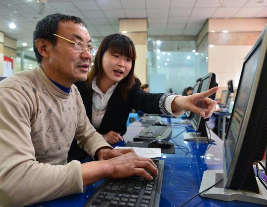 Man and woman working on a computer Man and woman working on a computer